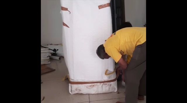 Perfect Packers Movers team in yellow uniform doing office shifting in Delhi