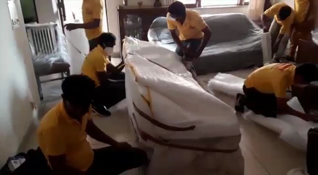 Perfect Packers Movers wrapping appliance in Janakpuri Delhi